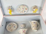 a box that has a bunch of cups and saucers in it