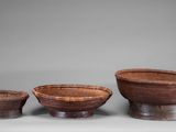 three bowls and a bowl on a table with a gray background