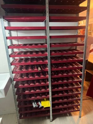 a rack with many trays of food on it