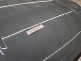 a close up of a car with a name tag on it