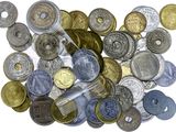 a lot of coins that are on a white surface