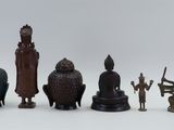 a lot of figurines that are sitting on a table