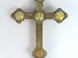a cross on a white surface with a blue background