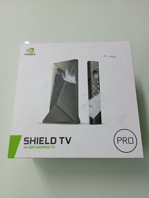 packaging of a box with a remote control inside of it on a table