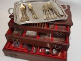 a tray with silverware in it and a tray with silverware in it