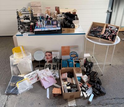 a lot of makeup and cosmetics products on the ground