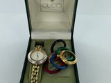 a box with a watch, bracelet, and bracelets in it