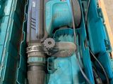 a blue box with a drill and a blue tool in it