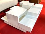 boxes are stacked on top of each other on a red carpet