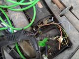 a green hose that is connected to a black box