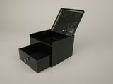 an image of a black box with two drawers on a white surface