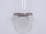 an image of a diamond ring on a clear ring holder