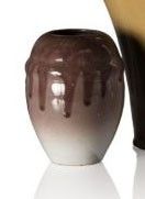 two vases sitting next to each other on a white surface