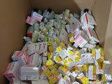 a cardboard box filled with lots of different types of medicine