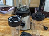 a blender sitting on top of a wooden table