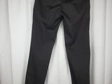 a pair of black pants hanging on a white curtain