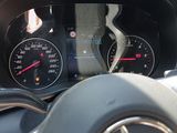 a car dashboard with a speedometer and a steering wheel