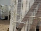 a large pile of white marble slabs on a pallet