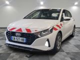the front of a white car with red and white stripes on it