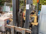 a fork lift truck that is parked in a lot