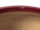 a close up view of a red vase with a heart on it