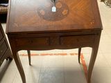 a small wooden desk with a drawer underneath it