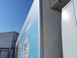 a truck that is parked next to a building