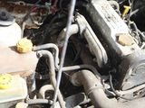 a close up of a car ' s engine with a yellow cap on it