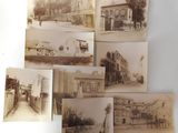 several old black and white photos of a street and buildings