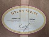 a label on the back of a guitar that says nylon series