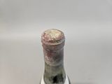 a bottle of wine that is sitting on a table