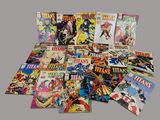 a pile of comics sitting on top of each other on a table
