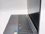 a laptop that is open on a white surface