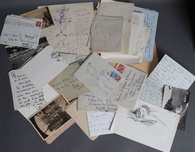 a pile of old letters and postcards on a table