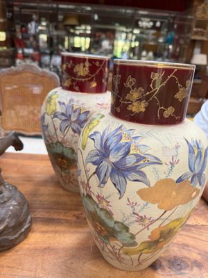 three vases that are sitting on a table