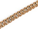a close up of a gold chain on a white background