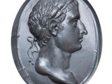 an old silver coin with a head of a woman on it