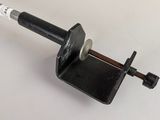 an image of a small metal object on a white surface