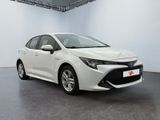 a white toyota corollant parked in a white room