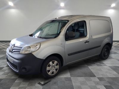 a picture of a silver van parked on a checkered floor