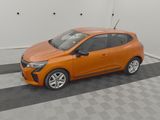 an orange car parked in a garage with a checkered floor