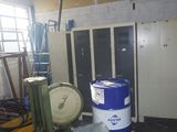 a picture of a room with a large scale and a blue barrel