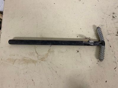 a picture of a hammer and a screw on a table