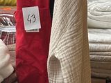 a lot of blankets on a table in a room
