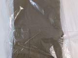 a plastic bag that has a brown shirt in it