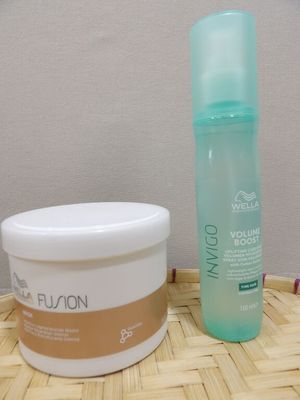 a bottle of lotion and a container of lotion sitting on a table