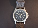 a close up of a wrist watch on a table