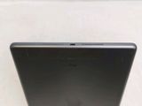 the back of a laptop computer sitting on top of a white surface
