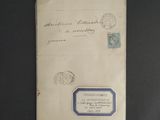 an old envelope with a stamp on it sitting on top of a table