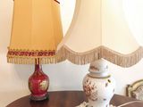 a table with a lamp and a lamp shade on it